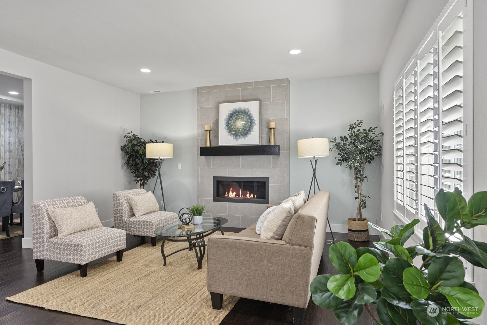 4404 181st Street Southeast Bothell, WA 98012 - Photo 9 of 37 a living room with furniture a potted plant and a fireplace
