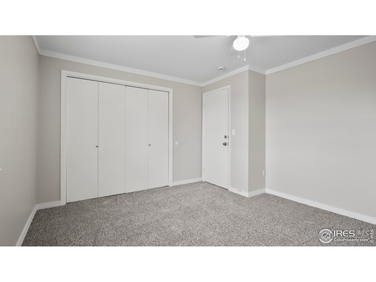 215 Chestnut Street, Unit A5 Windsor, CO 80550 - Photo 13 of 18 a open hall with wooden floor