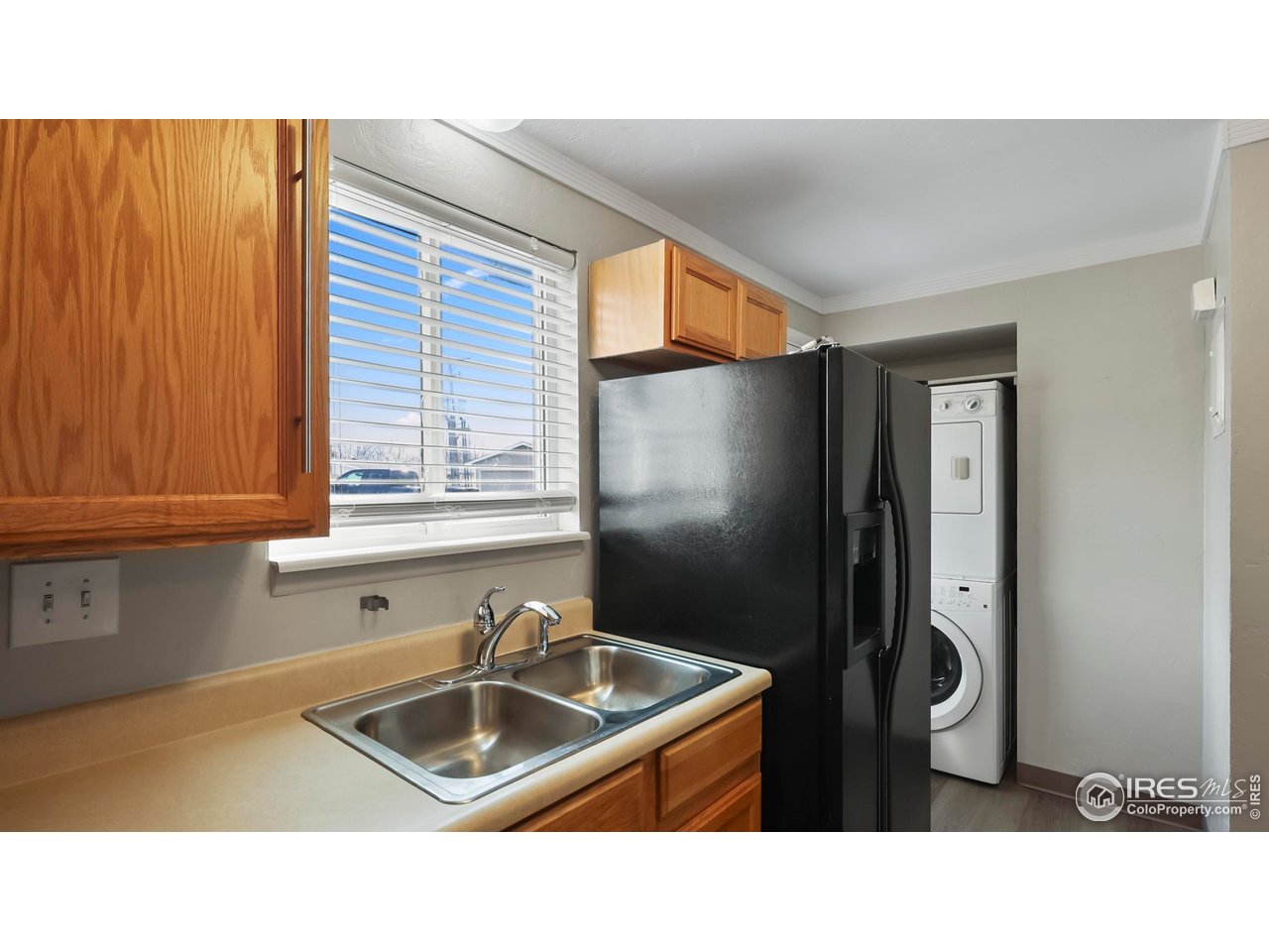 215 Chestnut Street, Unit A5 Windsor, CO 80550 - Photo 8 of 18 a bathroom with a sink a toilet and mirror