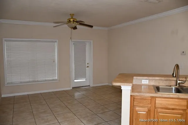 a kitchen with a sink and a microwave