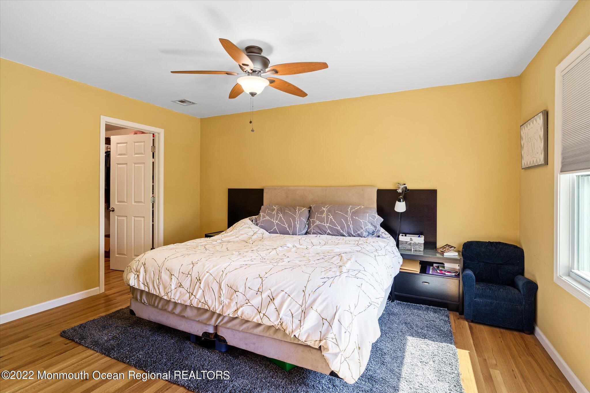 2 Sunset Drive Howell, NJ 07731 - Photo 31 of 41 a bedroom with a bed and wooden floor