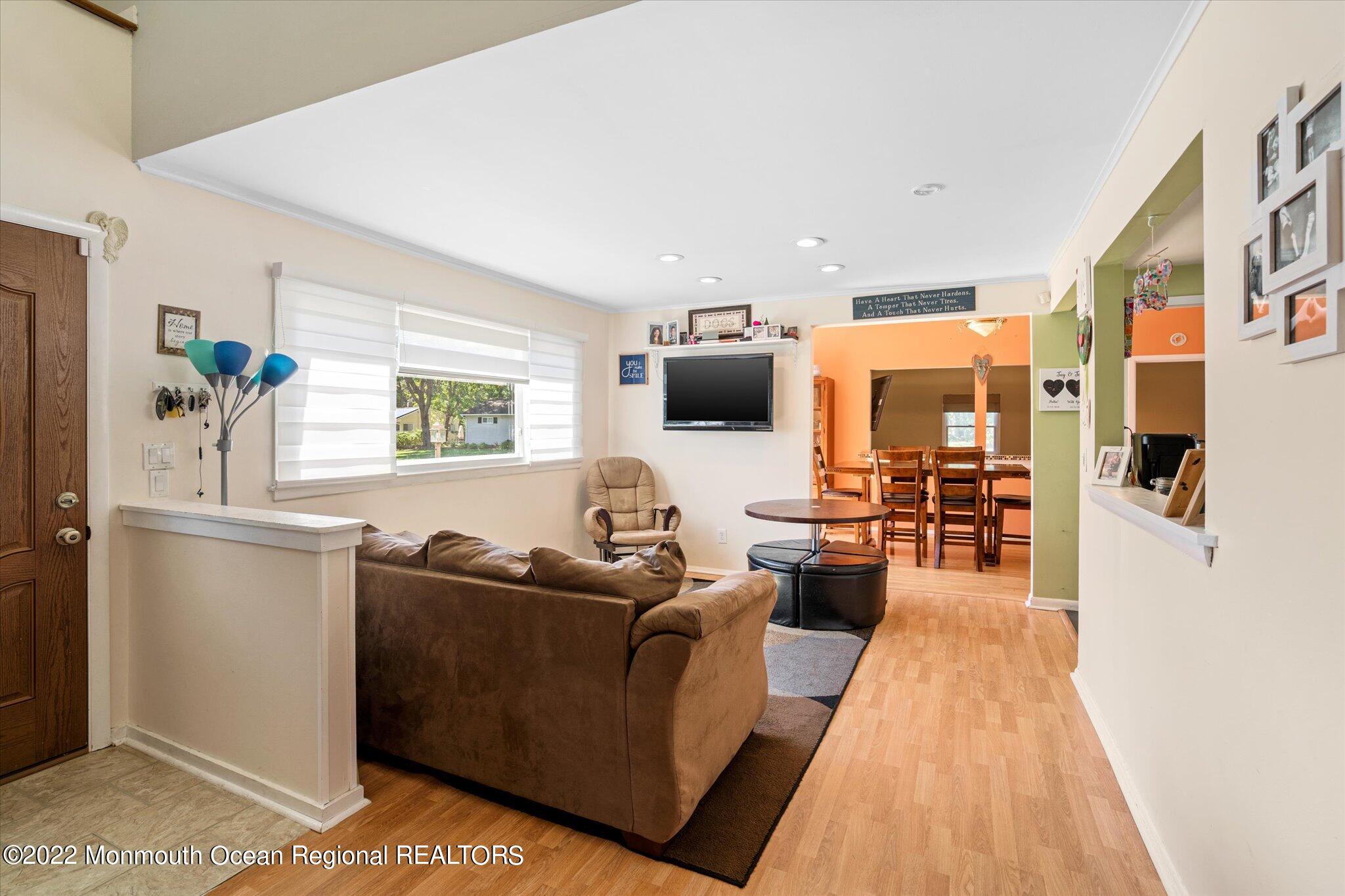 2 Sunset Drive Howell, NJ 07731 - Photo 38 of 41 a living room with furniture and a flat screen tv