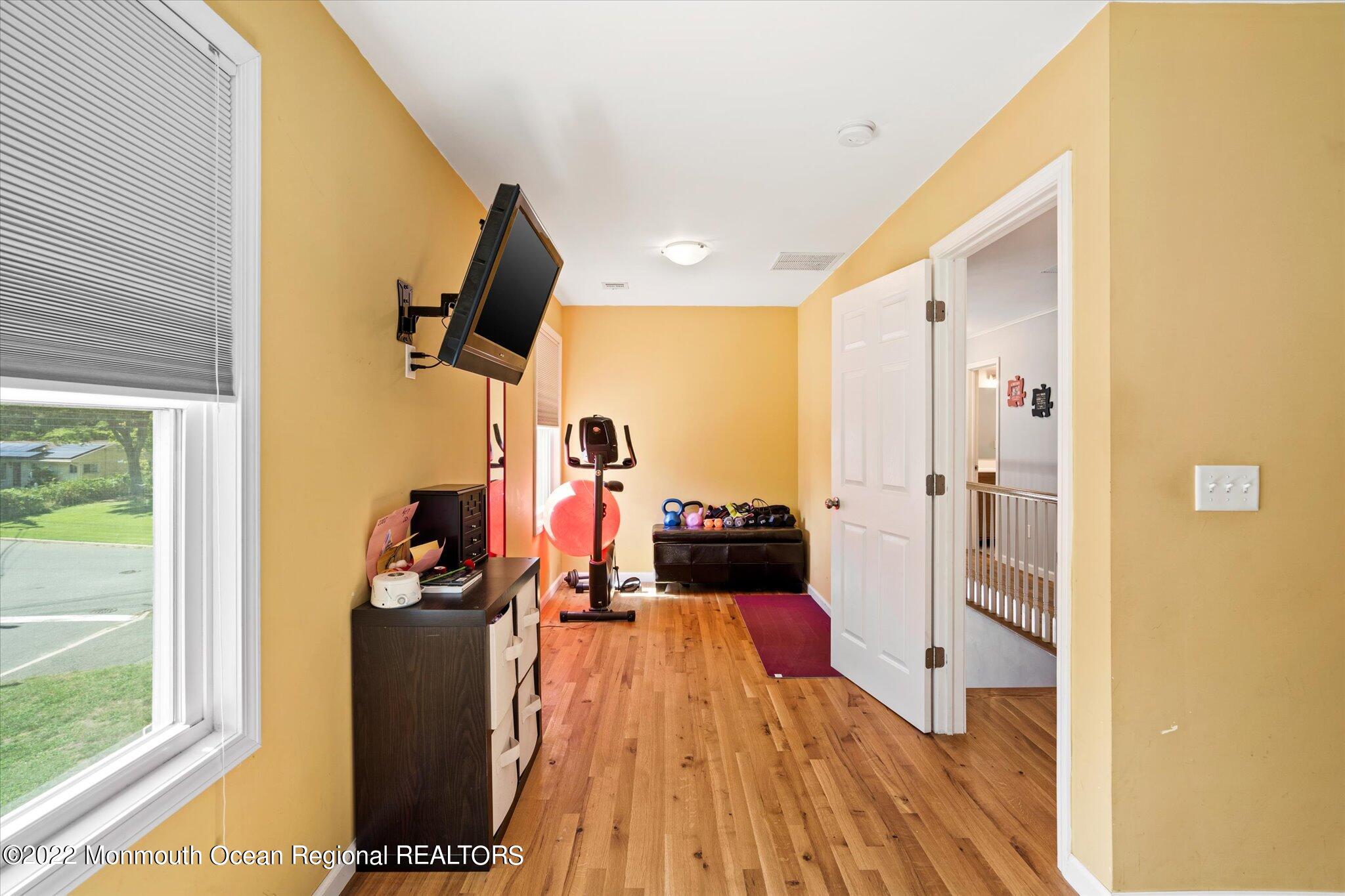 2 Sunset Drive Howell, NJ 07731 - Photo 4 of 41 a view of a living room with a large window and wooden floor
