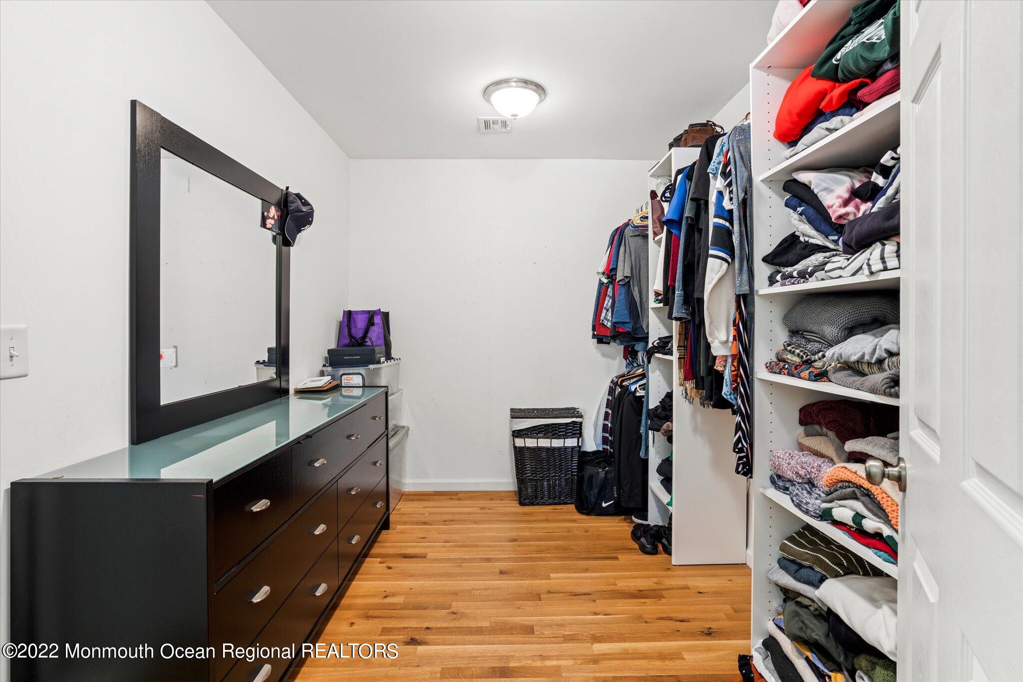 2 Sunset Drive Howell, NJ 07731 - Photo 5 of 41 a view of a bedroom with clothes shoes and a bed