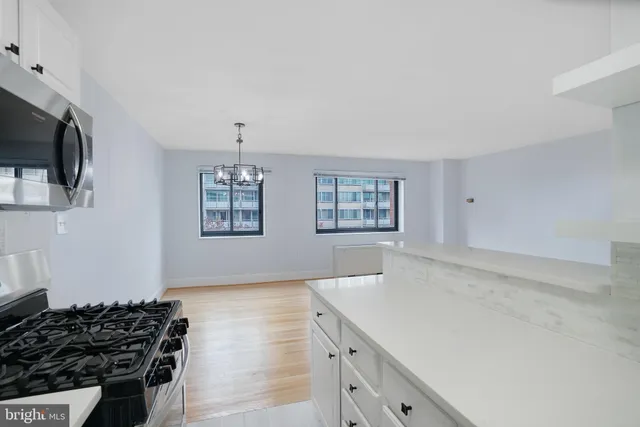 a kitchen with a stove and a refrigerator