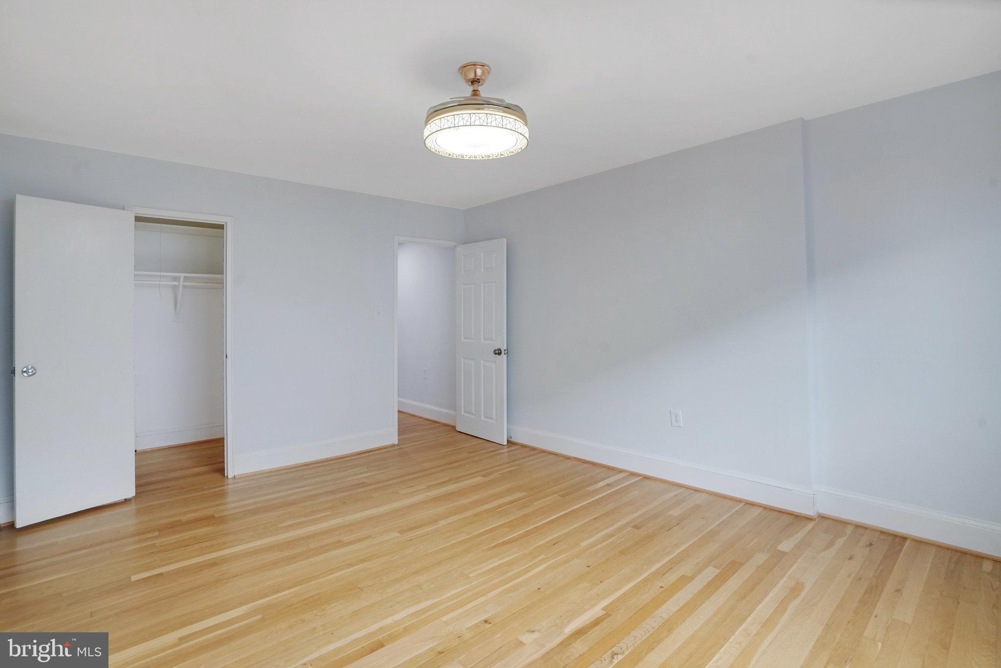 1200 South Arlington Ridge Road, Unit 612 Arlington, VA 22202 - Photo 18 of 27 a view of an empty room with wooden floor and a window