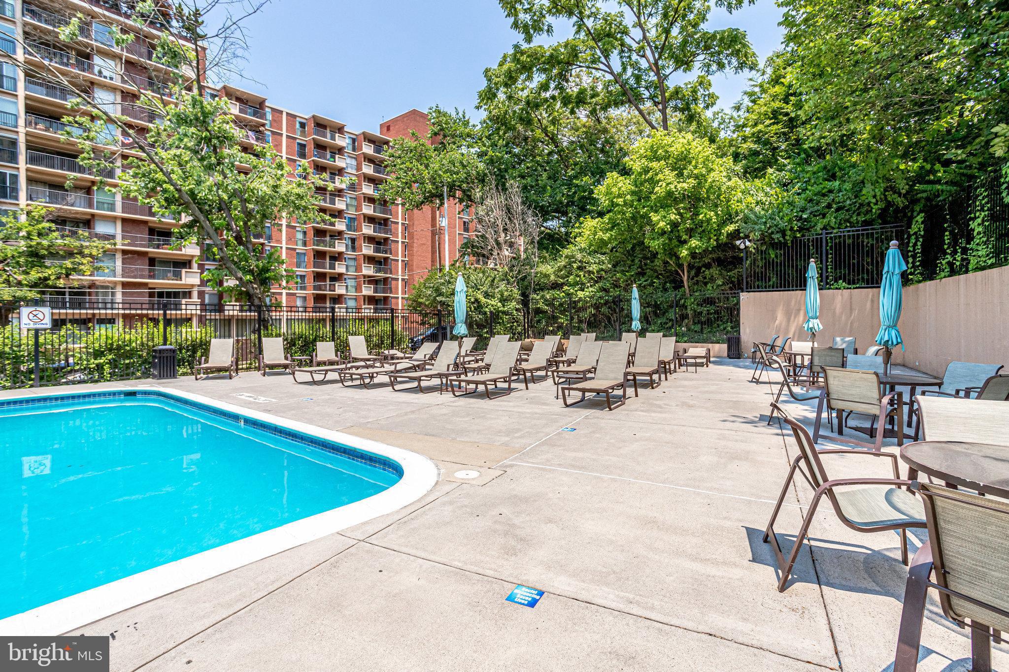 1200 South Arlington Ridge Road, Unit 612 Arlington, VA 22202 - Photo 26 of 27 a view of swimming pool with outdoor seating and plants
