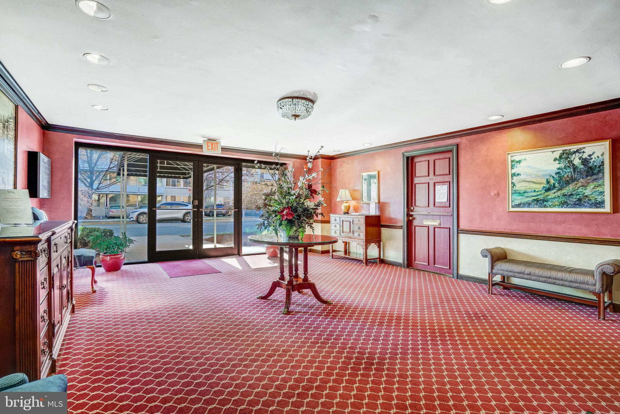 1200 South Arlington Ridge Road, Unit 612 Arlington, VA 22202 - Photo 6 of 27 a living room with furniture floor to ceiling window and a flat screen tv