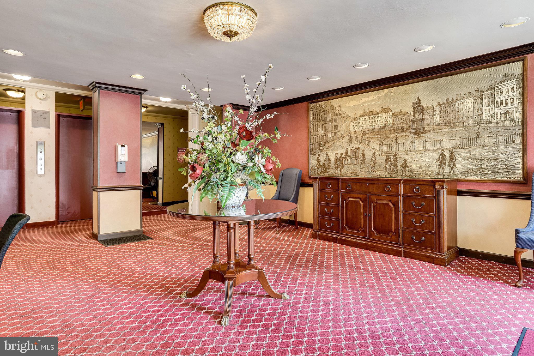 1200 South Arlington Ridge Road, Unit 612 Arlington, VA 22202 - Photo 7 of 27 a lobby with furniture and floor to ceiling window