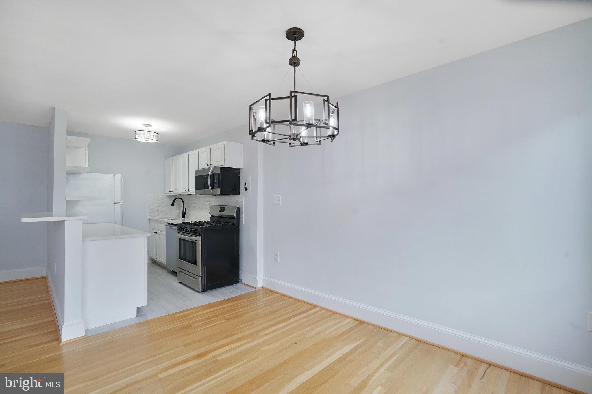 1200 South Arlington Ridge Road, Unit 612 Arlington, VA 22202 - Photo 10 of 27 a view of a kitchen with stove and refrigerator