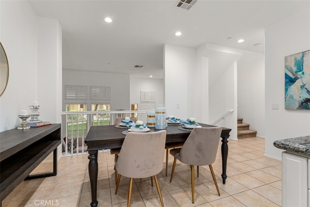 8483 Kendra Loop Orange, CA 92867 - Photo 15 of 30 a view of a dining room with furniture
