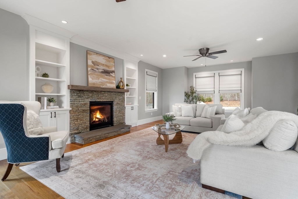 9 Wedge Way Rehoboth, MA 02769 - Photo 11 of 42 a living room with furniture and a fireplace