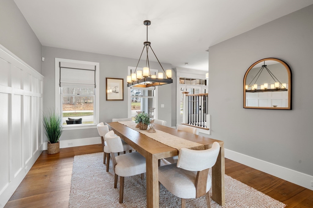 9 Wedge Way Rehoboth, MA 02769 - Photo 13 of 42 a dining room with furniture a chandelier and wooden floor