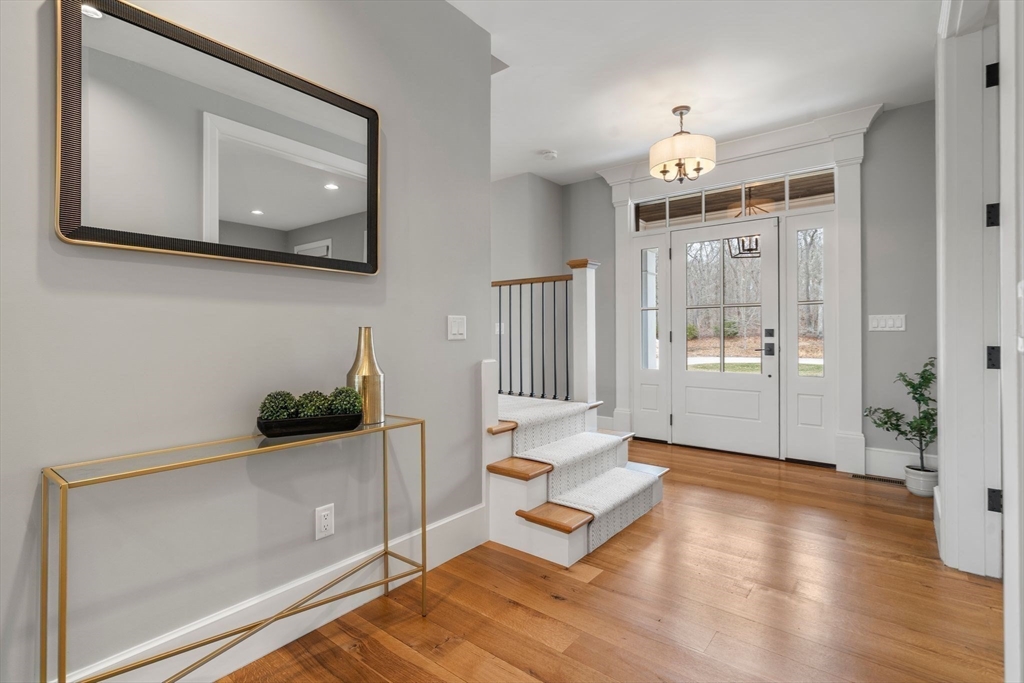 9 Wedge Way Rehoboth, MA 02769 - Photo 16 of 42 a living room with furniture and a chandelier