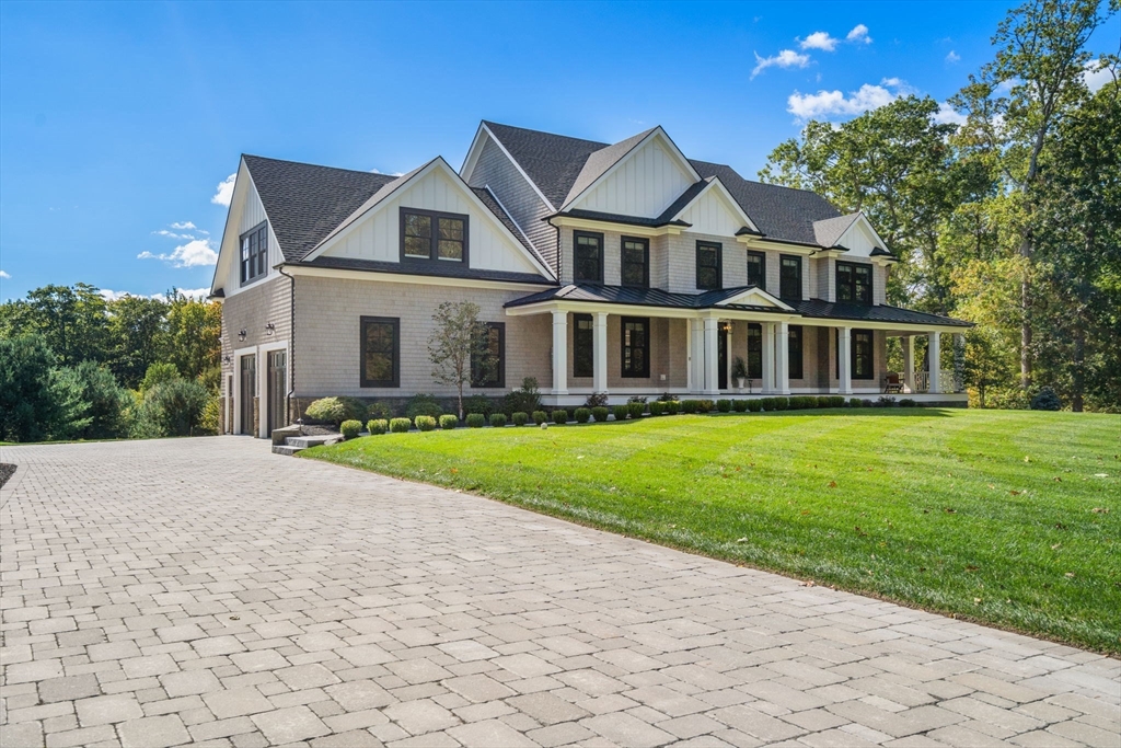 9 Wedge Way Rehoboth, MA 02769 - Photo 2 of 42 a front view of a house with a yard and trees
