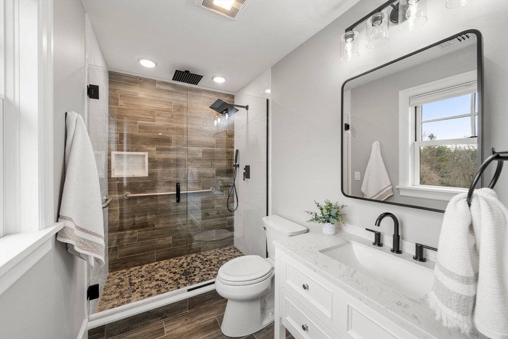 9 Wedge Way Rehoboth, MA 02769 - Photo 29 of 42 a bathroom with a sink a toilet and shower