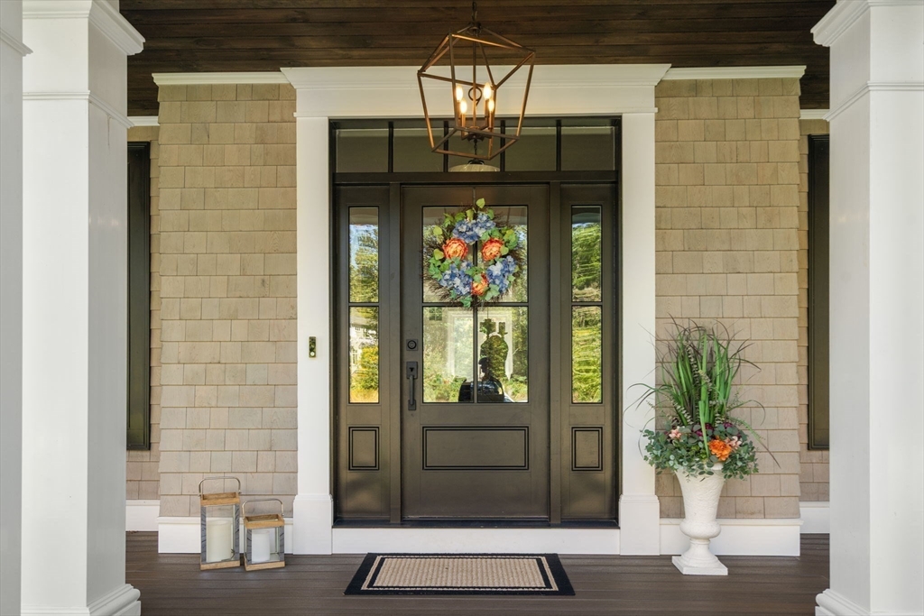9 Wedge Way Rehoboth, MA 02769 - Photo 3 of 42 a front view of a house with a potted plant