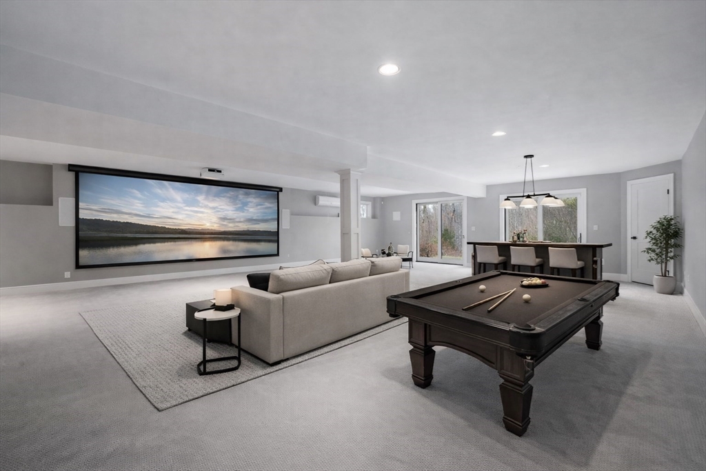 9 Wedge Way Rehoboth, MA 02769 - Photo 33 of 42 a living room with furniture a rug and a flat screen tv