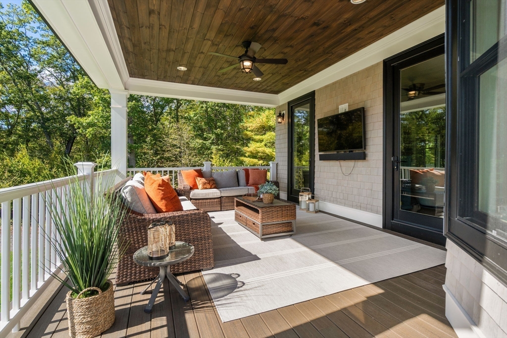9 Wedge Way Rehoboth, MA 02769 - Photo 34 of 42 a living room with patio furniture and a floor to ceiling window