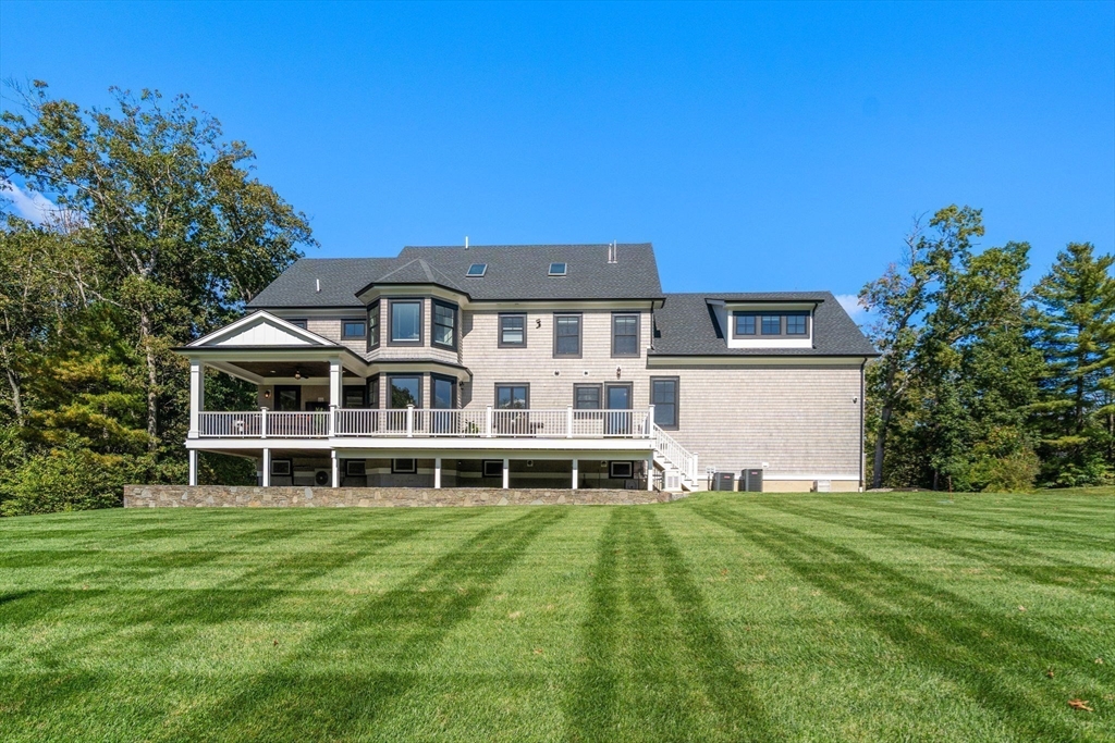 9 Wedge Way Rehoboth, MA 02769 - Photo 38 of 42 a front view of a house with a yard