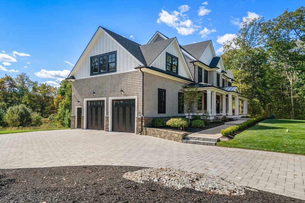 9 Wedge Way Rehoboth, MA 02769 - Photo 39 of 42 a front view of a house with garden and garage