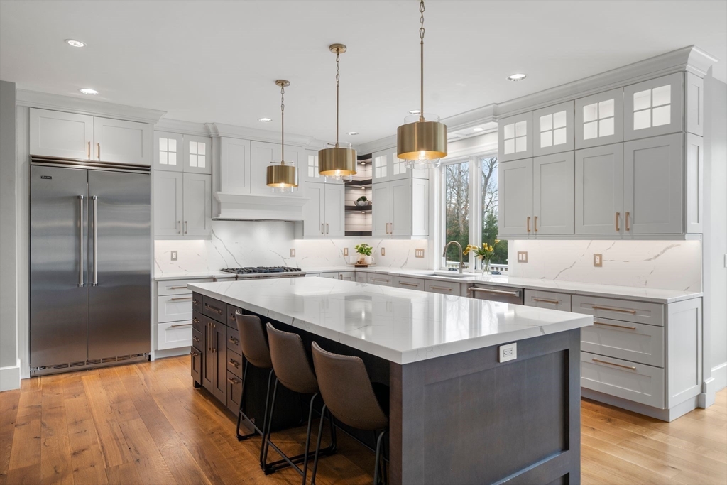 9 Wedge Way Rehoboth, MA 02769 - Photo 5 of 42 a kitchen with stainless steel appliances granite countertop a sink a stove and a refrigerator