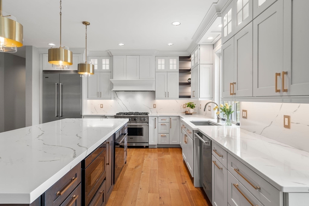9 Wedge Way Rehoboth, MA 02769 - Photo 6 of 42 a kitchen with stainless steel appliances granite countertop a sink a stove and a refrigerator
