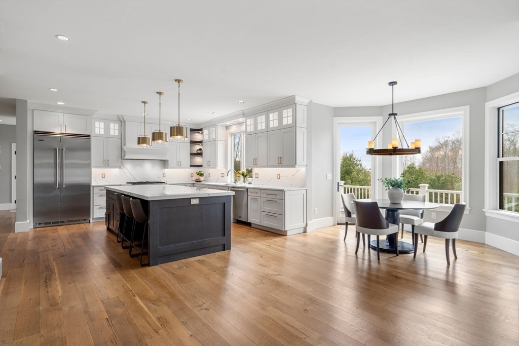 9 Wedge Way Rehoboth, MA 02769 - Photo 9 of 42 a large white kitchen with a large window and stainless steel appliances
