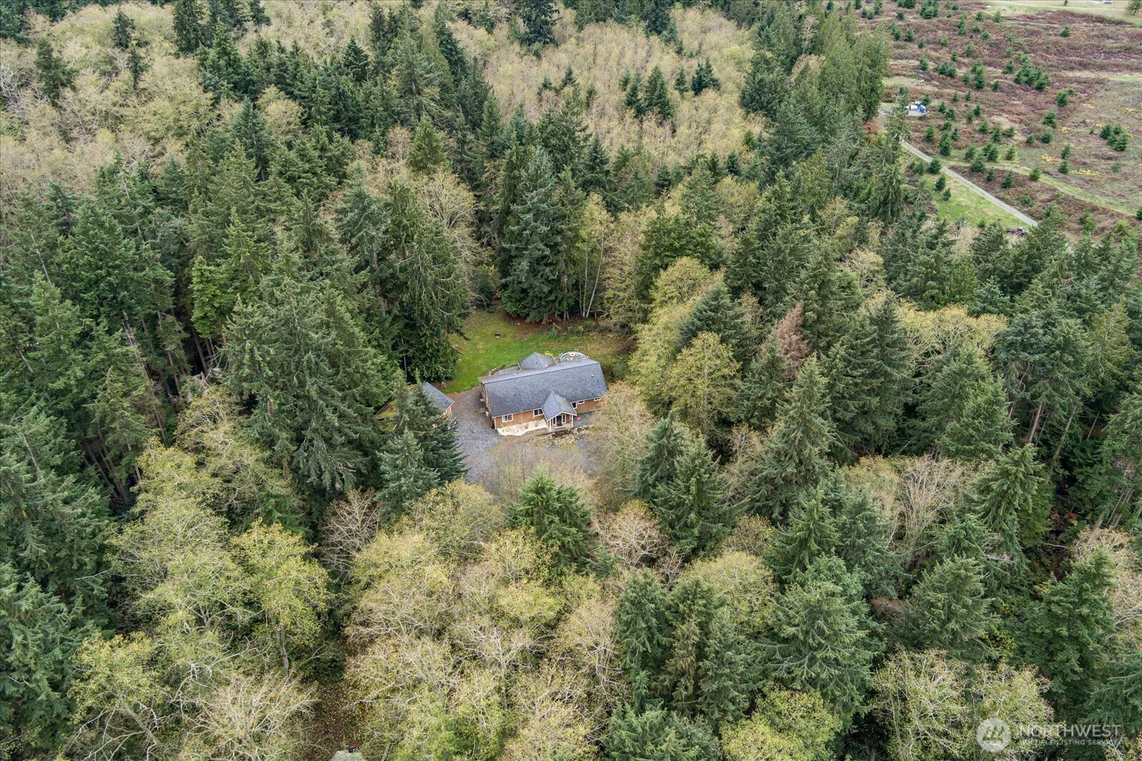 2013 Goss Ridge Road Freeland, WA 98249 - Photo 12 of 24 an aerial view of a house with yard and outdoor seating