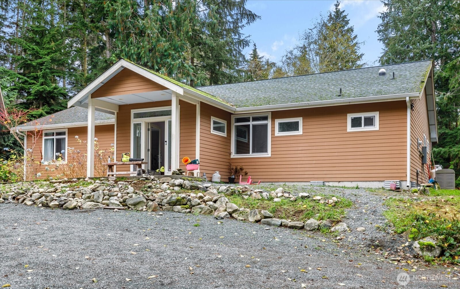 2013 Goss Ridge Road Freeland, WA 98249 - Photo 2 of 24 a front view of a house with a garden