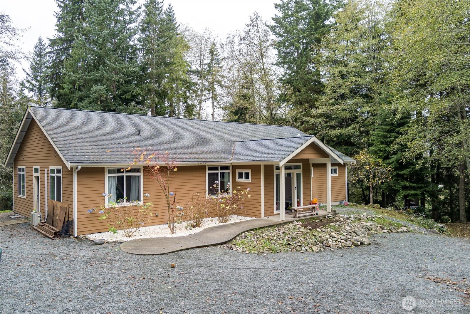 2013 Goss Ridge Road Freeland, WA 98249 - Photo 6 of 24 a view of a house with a backyard and windows