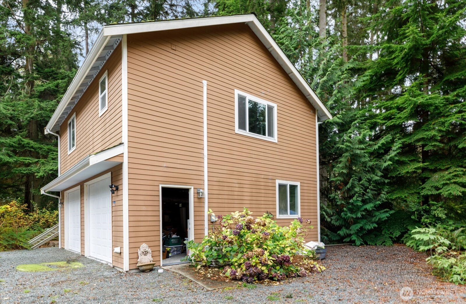 2013 Goss Ridge Road Freeland, WA 98249 - Photo 9 of 24 a view of a house with a yard and plants
