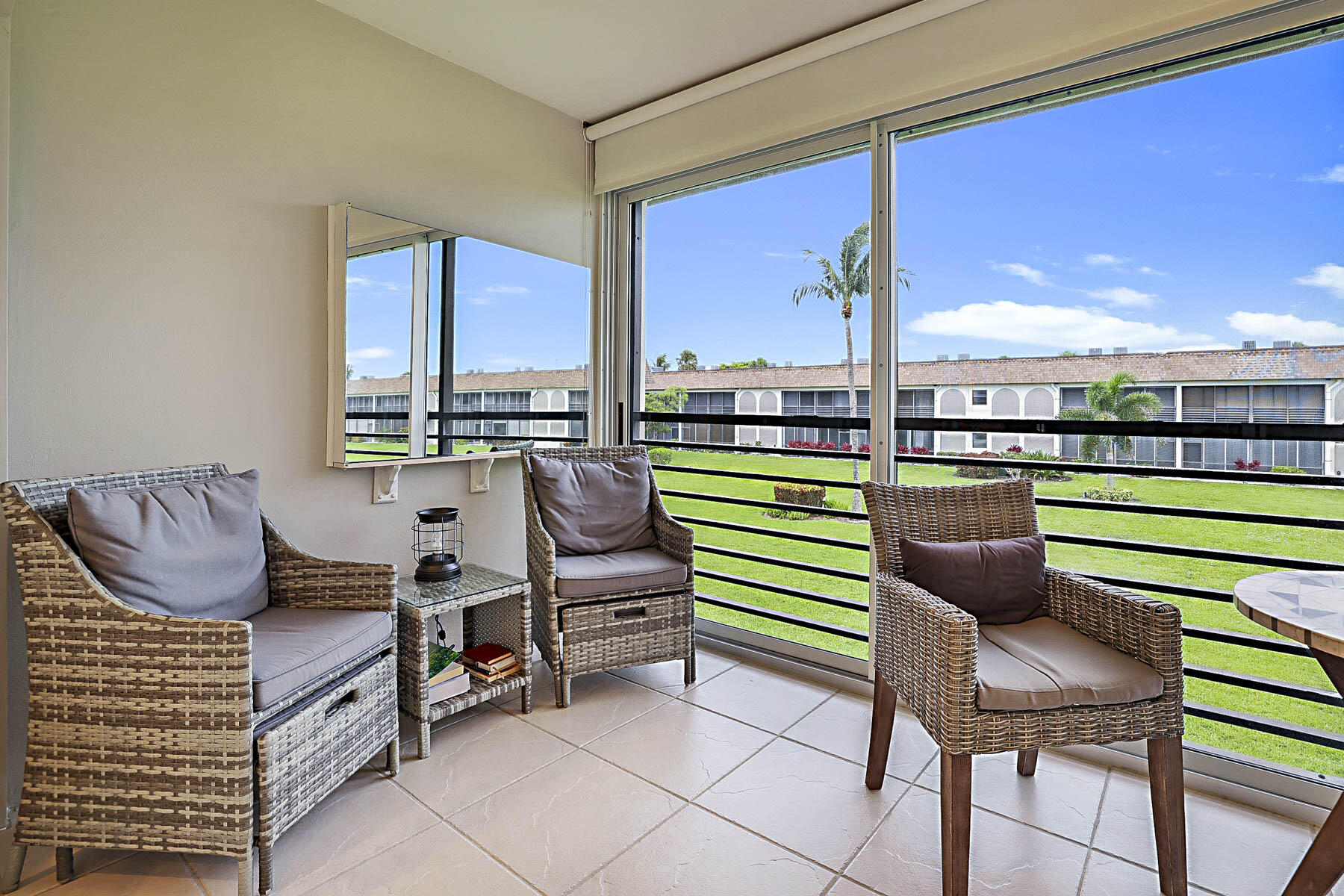 755 Saturn Street, Unit F203 Jupiter, FL 33477 - Photo 11 of 36 a room with furniture and a large window
