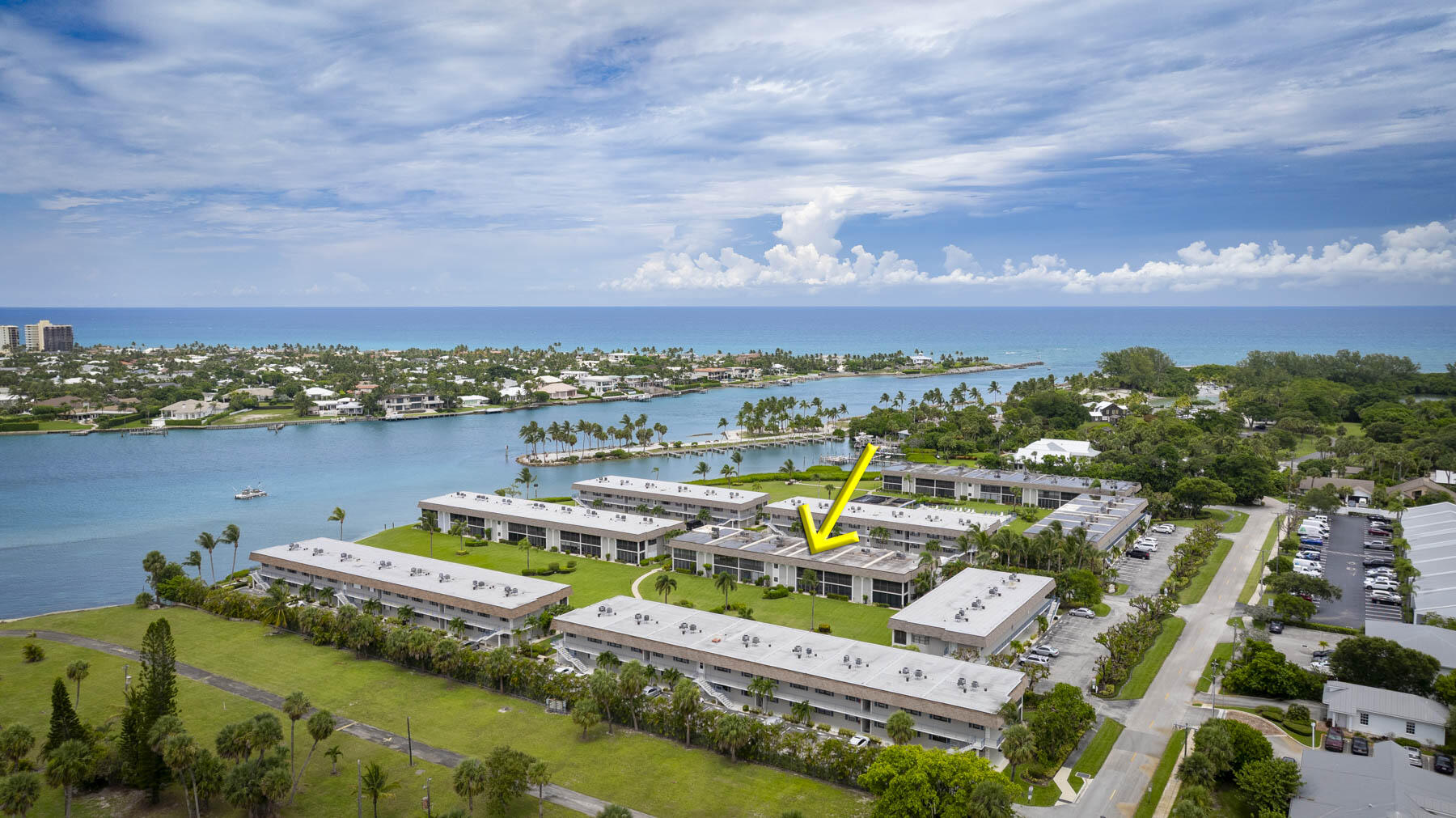 755 Saturn Street, Unit F203 Jupiter, FL 33477 - Photo 2 of 36 a view of a lake with a city