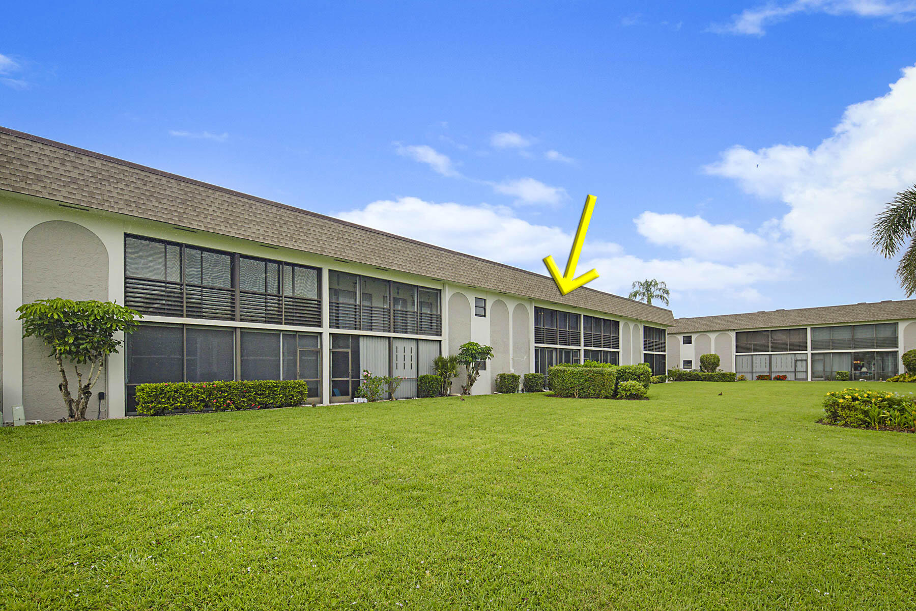 755 Saturn Street, Unit F203 Jupiter, FL 33477 - Photo 35 of 36 a view of a house with a big yard and large trees