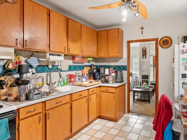 a kitchen with stainless steel appliances granite countertop a sink and cabinets