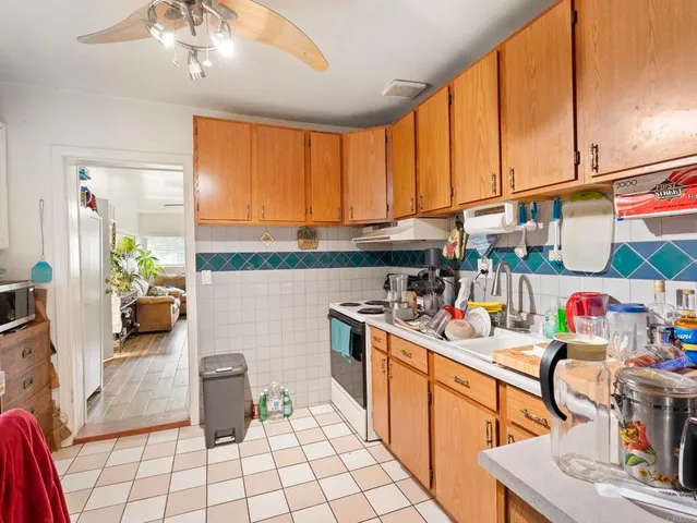 a kitchen with stainless steel appliances granite countertop a sink and cabinets