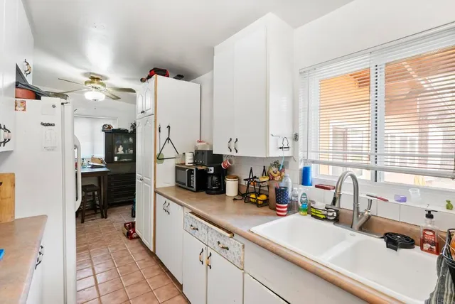 a kitchen with stainless steel appliances sink stove and refrigerator