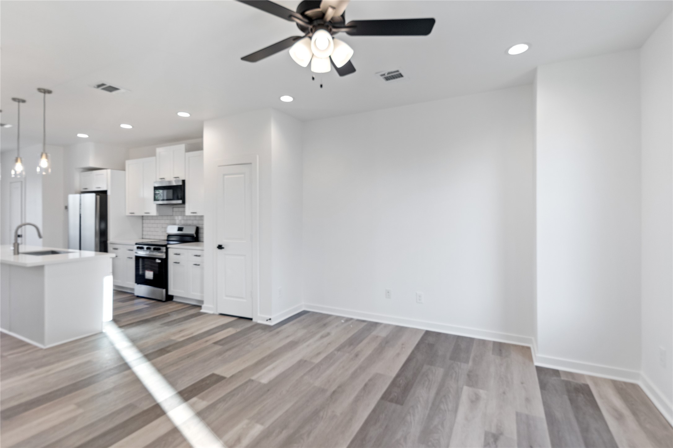 2702 Winbern Street, Unit A Houston, TX 77004 - Photo 13 of 16 a view of kitchen with wooden floor
