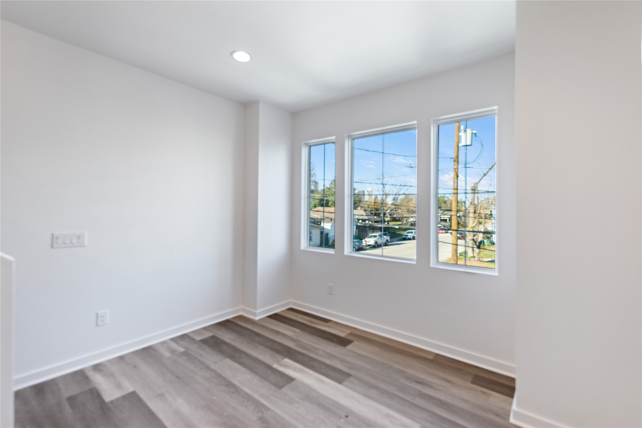 2702 Winbern Street, Unit A Houston, TX 77004 - Photo 8 of 16 a view of an empty room with a window