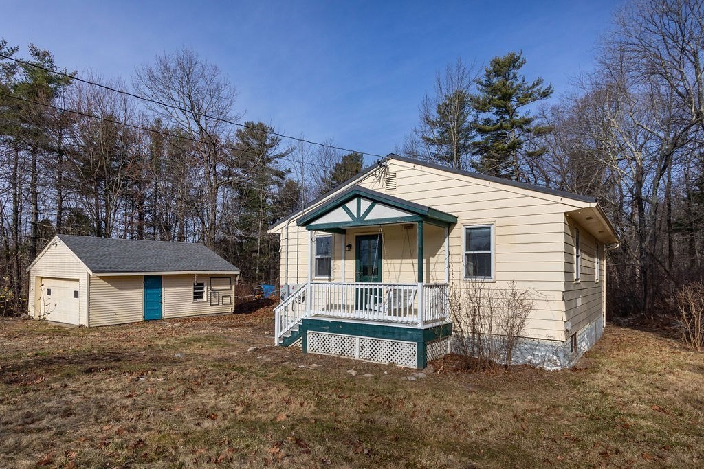 346 Amherst Road Pelham, MA 01002 - Photo 1 of 16 a view of house with a yard and large tree