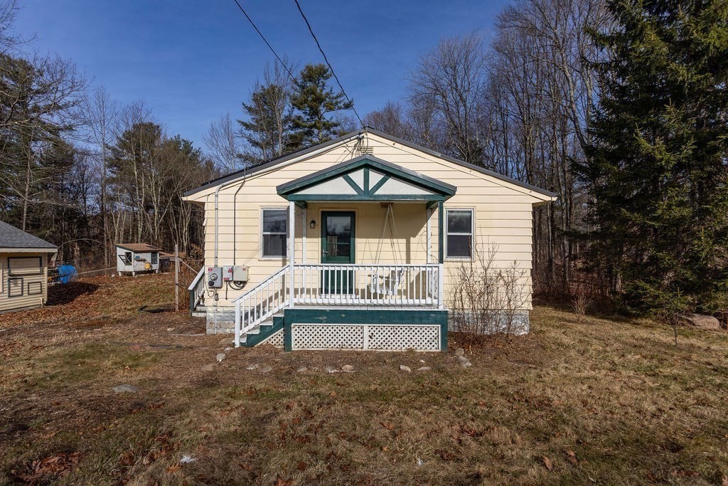 346 Amherst Road Pelham, MA 01002 - Photo 2 of 16 a front view of a house with garden