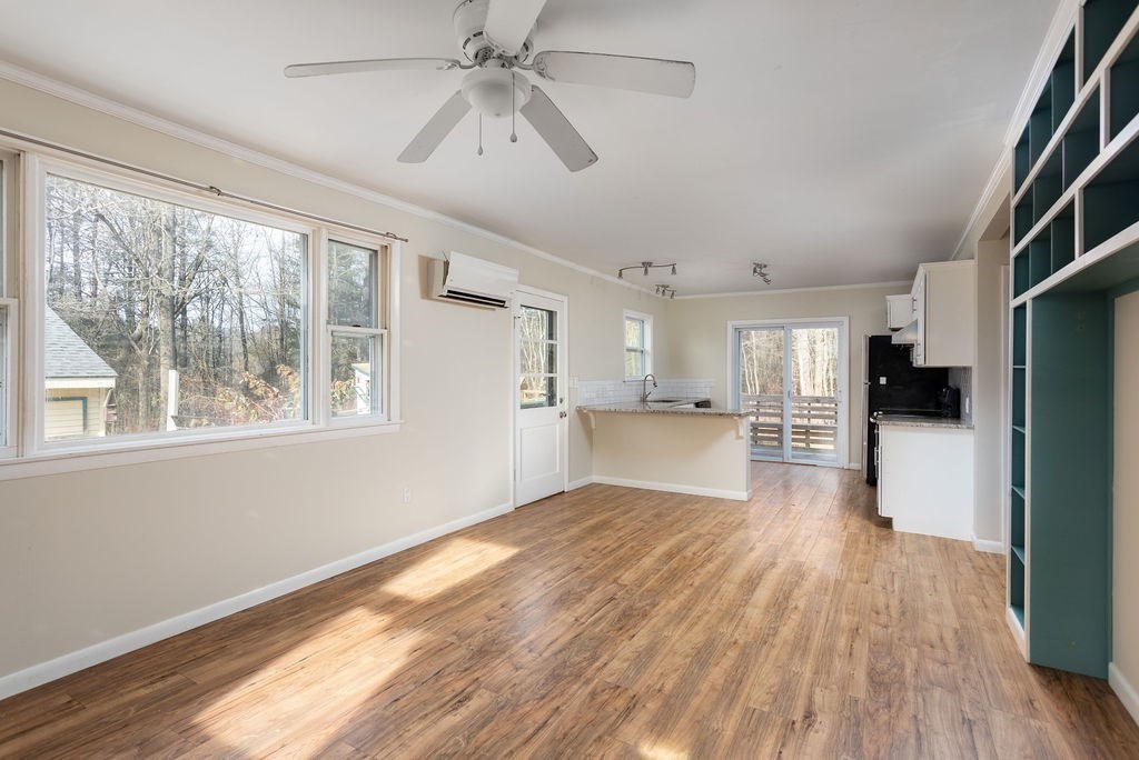 346 Amherst Road Pelham, MA 01002 - Photo 6 of 16 a view of a kitchen with wooden floor and a kitchen