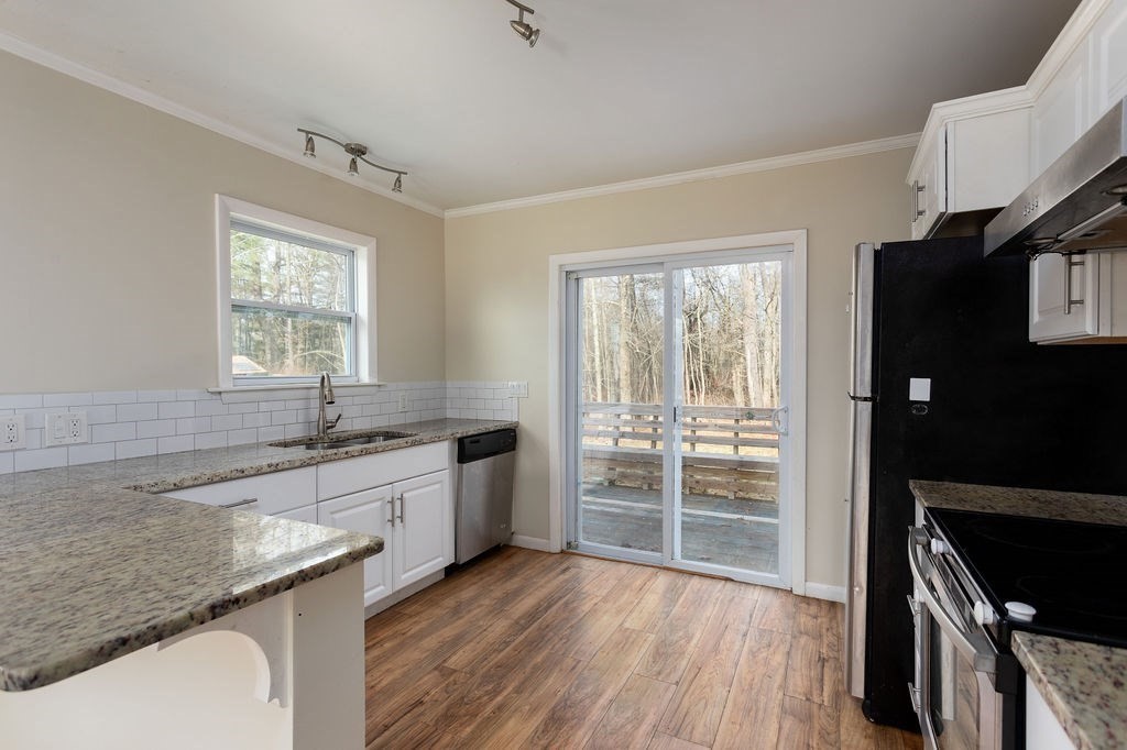 346 Amherst Road Pelham, MA 01002 - Photo 8 of 16 a kitchen with a sink stove and cabinets