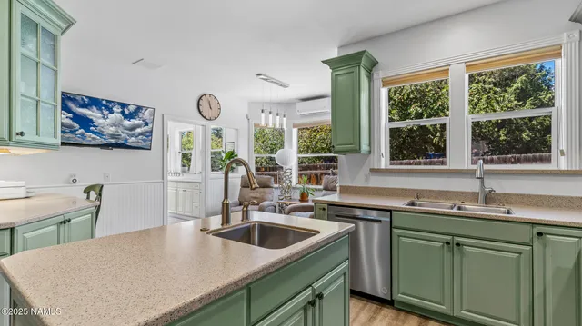 a bathroom with a sink vanity and a mirror