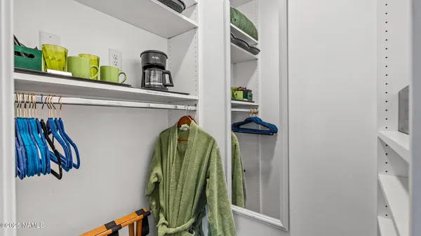 a bathroom with a glass shower door