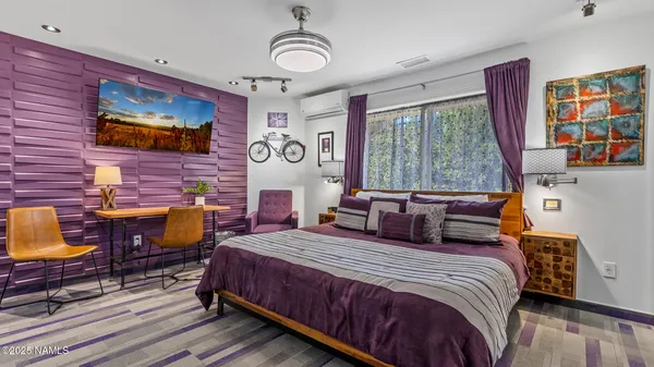 a bathroom with a sink a toilet a mirror a vanity and shower