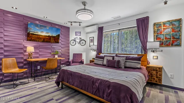 a bathroom with a sink a toilet a mirror a vanity and shower