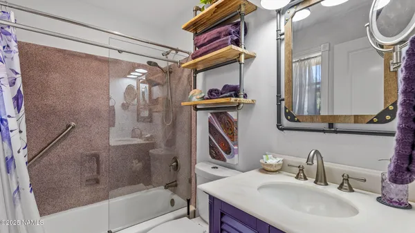 a bathroom with a sink double vanity and a mirror
