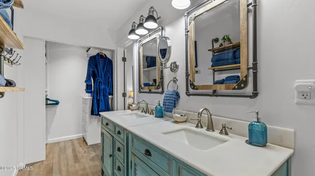 a room with furniture pool table chandelier and a rug